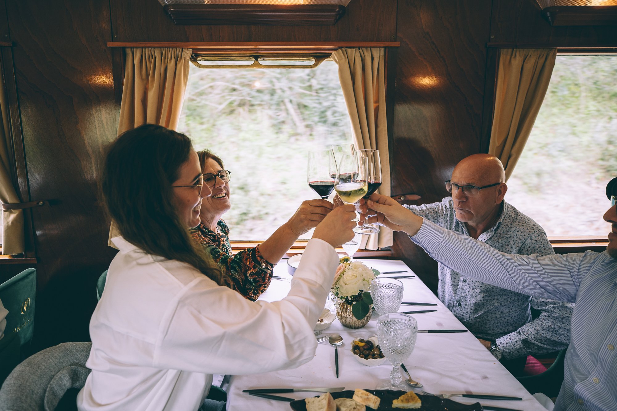 The picturesque Douro Valley unfolds, with terraced vineyards, meandering Douro River, and rolling hills, illustrating the breathtaking scenery witnessed during the Presidential Train journey.