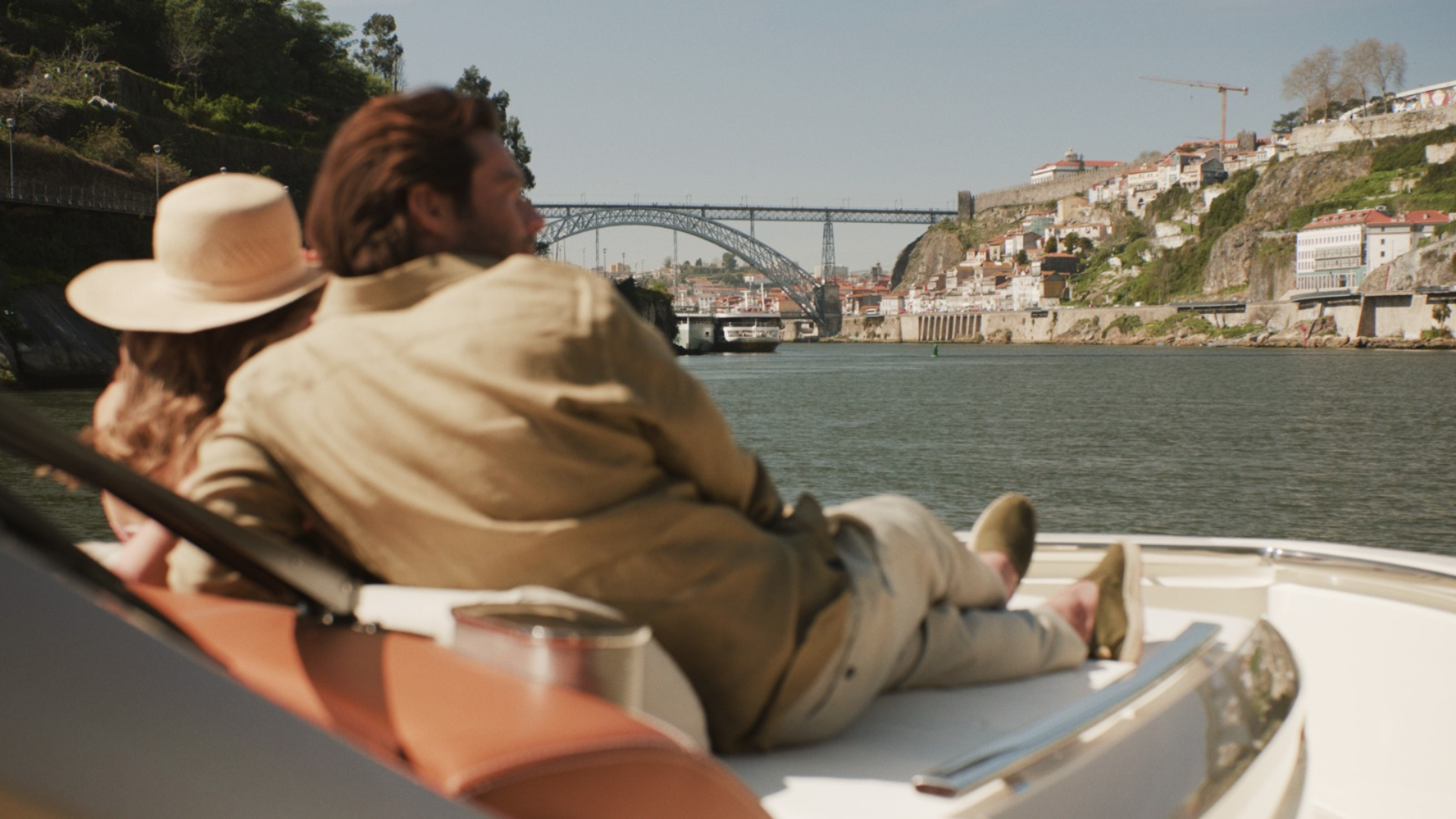 Luxury yacht tour departing from Vinha Boutique Hotel's private dock, offering exclusive boat cab service along the Douro River with stunning views of the Ribeira area.