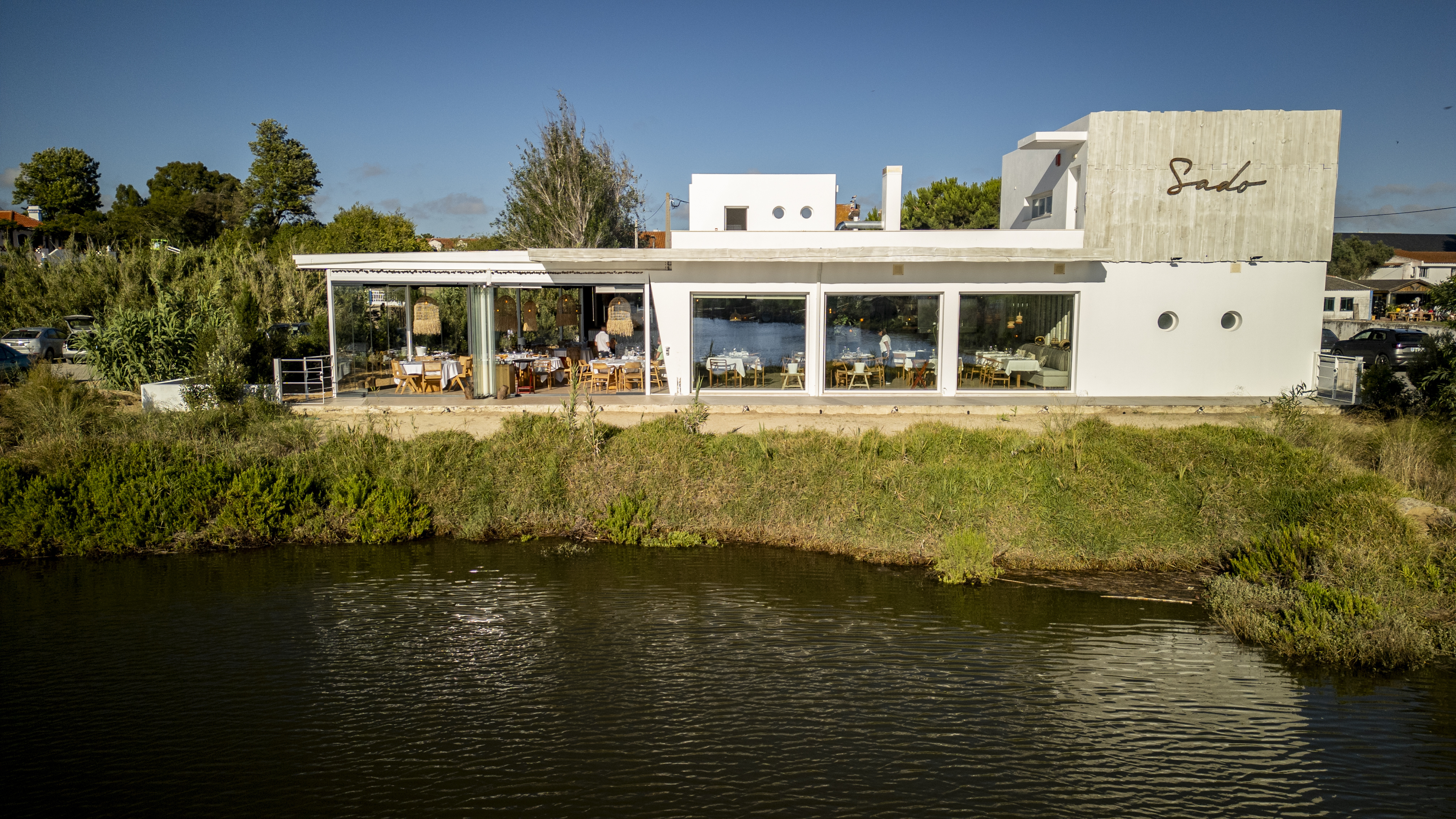 DJI_0023Exterior view of Sado Restaurant at the entrance of Comporta, overlooking the estuary and rice fields