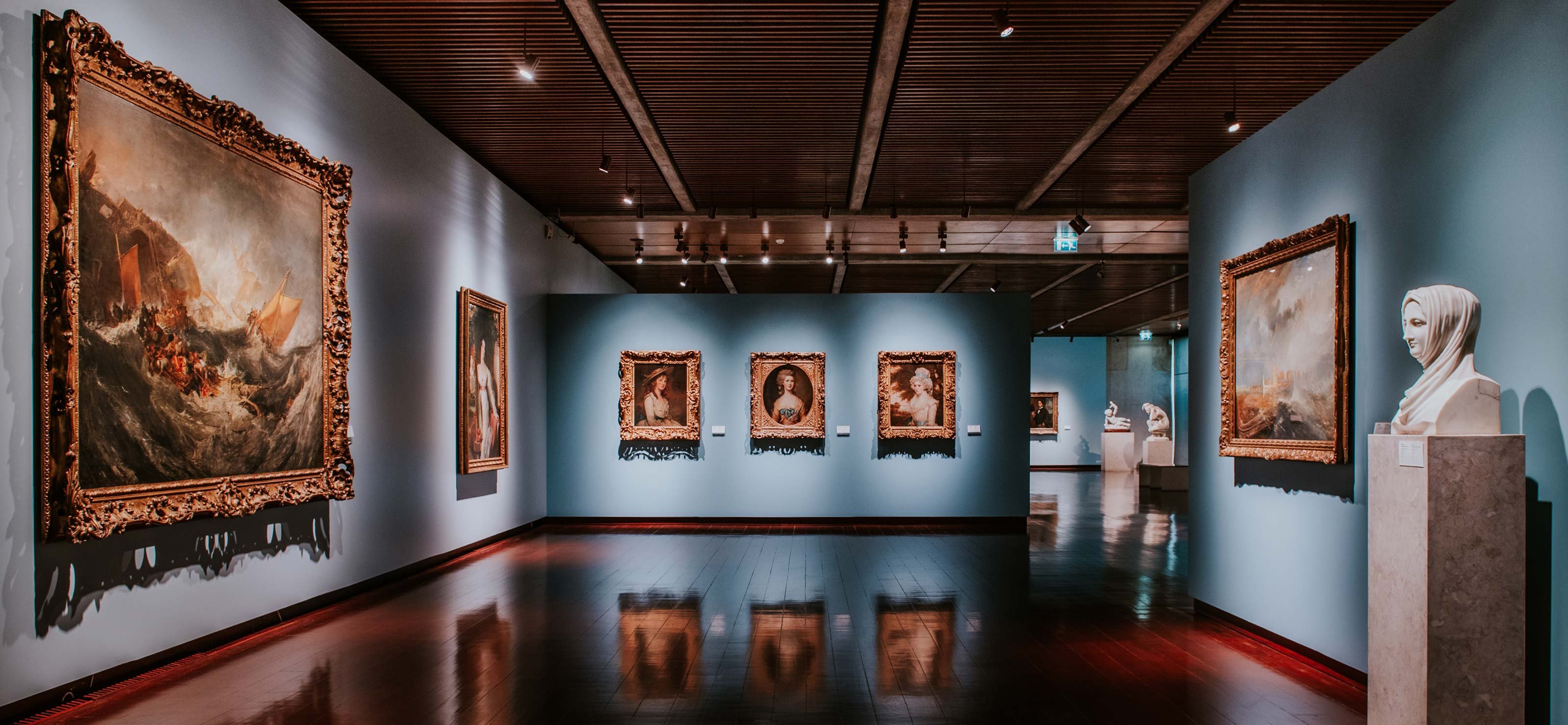 Interior of the Gulbenkian Museum in Lisbon, Portugal, showcasing its elegant and modern exhibition space with diverse art and cultural exhibits.