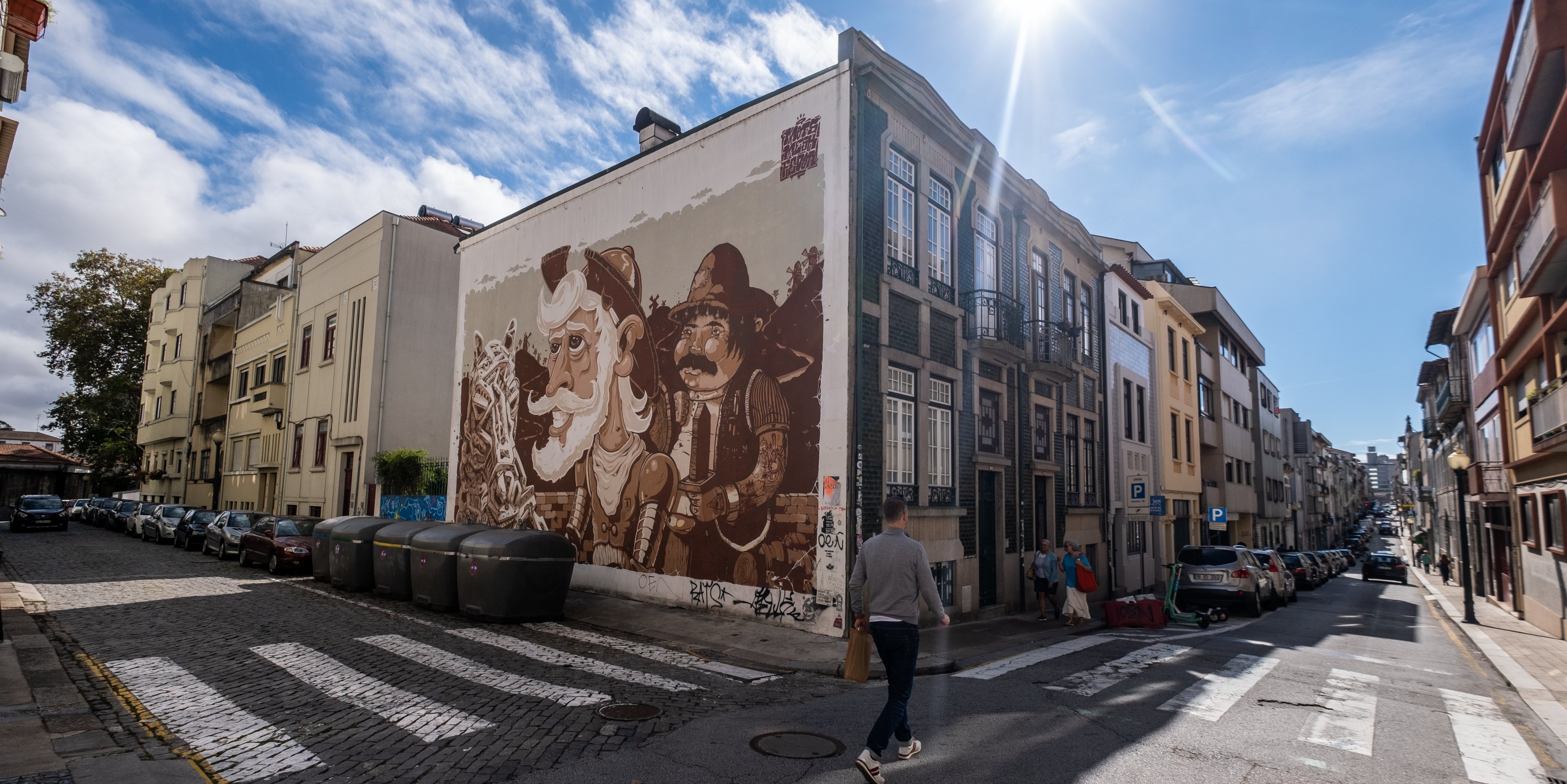 Vibrant street art mural in Porto, Portugal, showcasing a colorful and dynamic urban art piece that adds character to the city's streets.