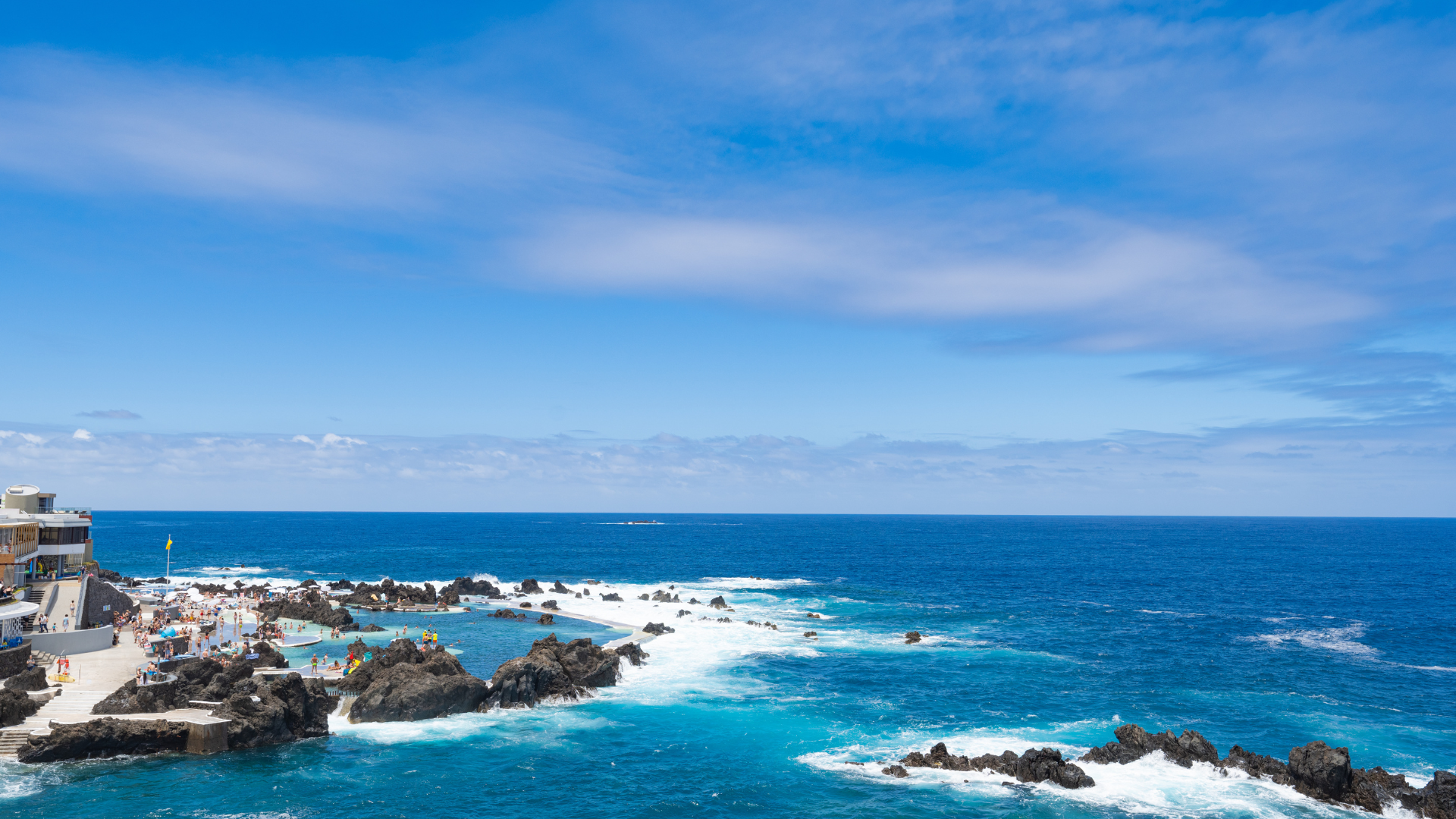 Volcanic Pools of Porto Moniz: Natural volcanic swimming pools in Porto Moniz, Madeira, with crystal-clear seawater and stunning coastal views.