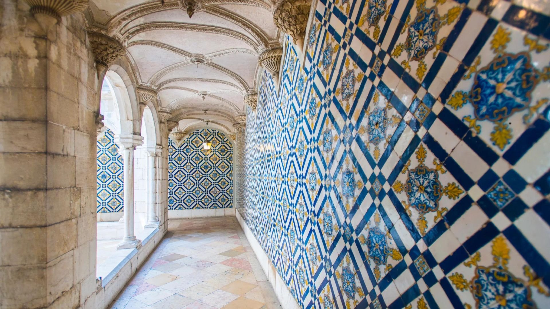 Interior of The National Tile Museum in Lisbon, Portugal, featuring intricate and beautifully designed ceramic tile displays that showcase the rich history of tile artistry in Portugal.