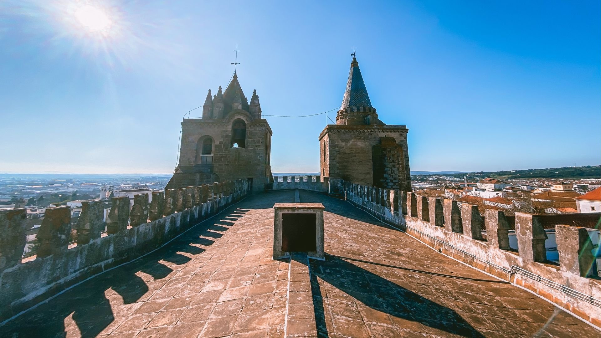 Panoramic view of Évora, a historic city in Portugal, featuring its charming cobblestone streets, well-preserved medieval architecture, and the iconic Temple of Diana, a Roman temple dating back to the 2nd century AD.