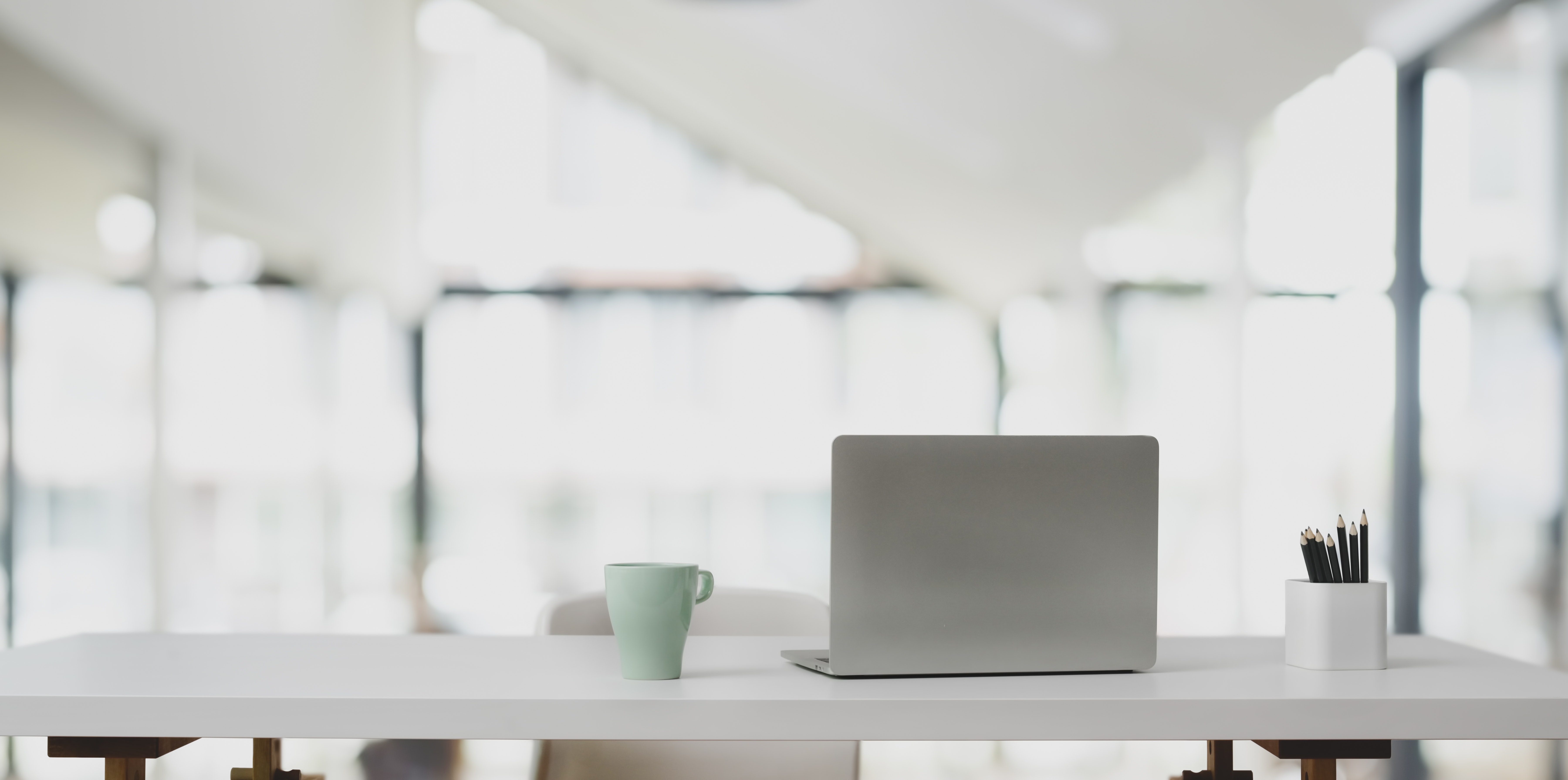 silver-laptop-in-white-wooden-table-3759098